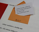 Vergrößerungsansicht: einzelne Buchseite, Motiv kleiner Briefumschlag