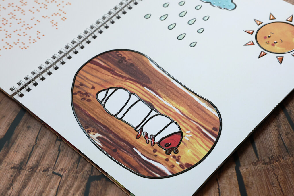 Eine weiße Hirschkäfer-Larve in einem Stück Holz