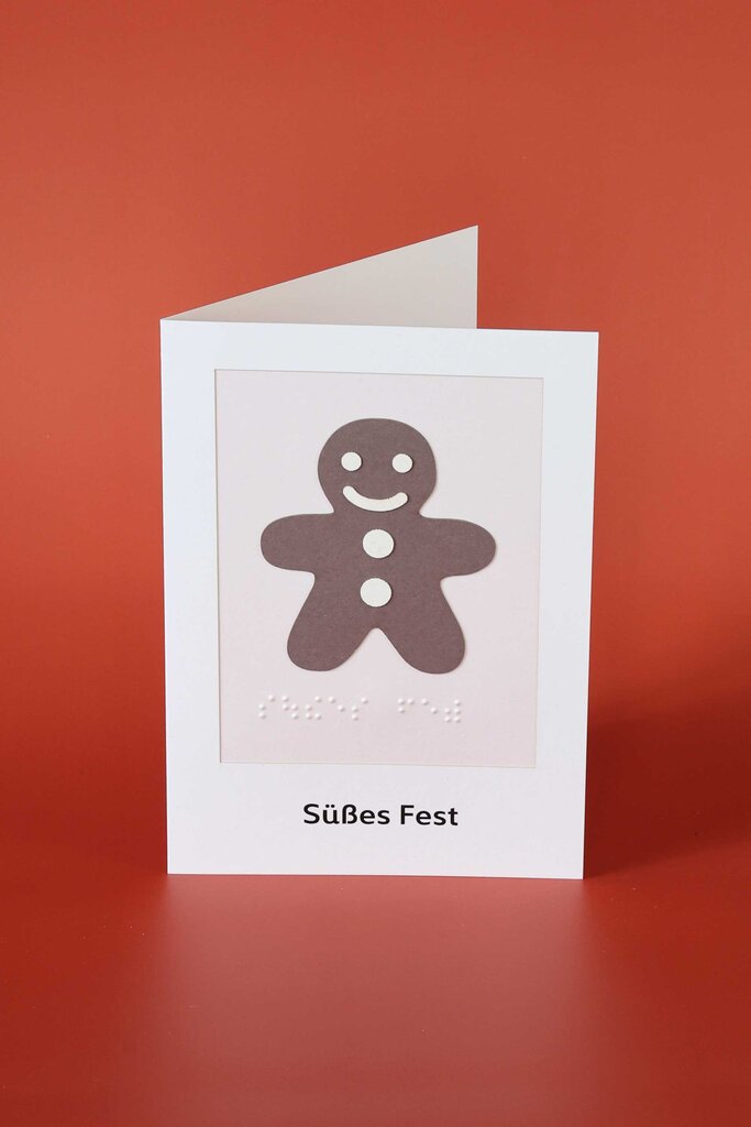 Klappkarte aus Papier mit taktil gestaltetem Lebkuchenmännlein