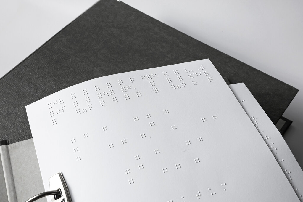 Detailaufnahme einer gedruckten Seite vom Punktum-Kurs.